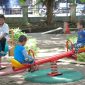 Anak-anak yang tengah bermain di taman layak anak di wilayah Kota Cilegon, tepatnya di depan Polres Cilegon, Dok Kominfo. 